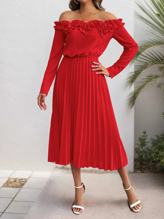 Red off-shoulder dress worn by a person with a white background