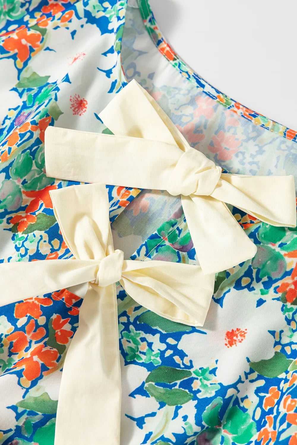 Floral Print Bow Applique Slit Sleeveless Peplum Blouse