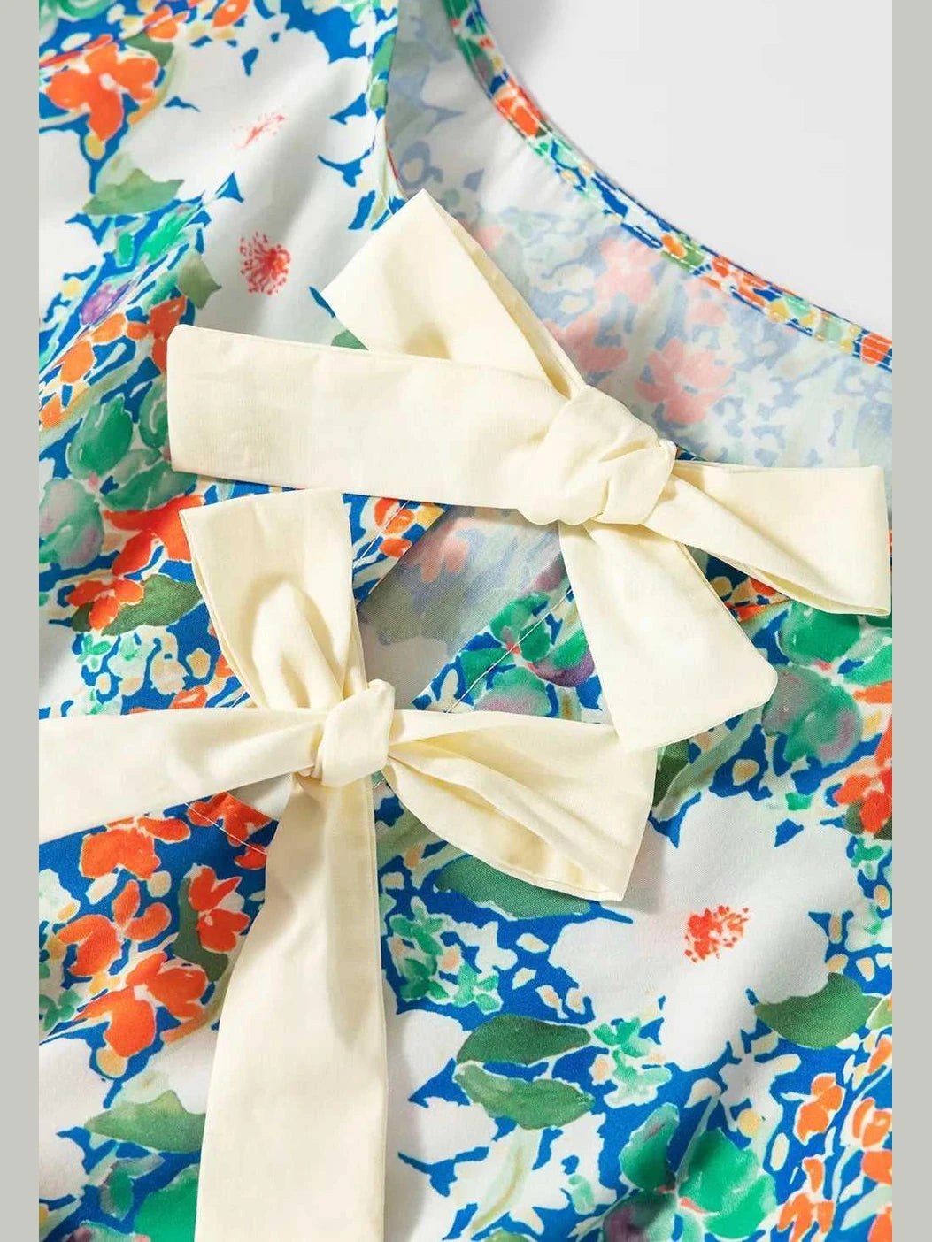 Floral Print Bow Applique Slit Sleeveless Peplum Blouse -- 